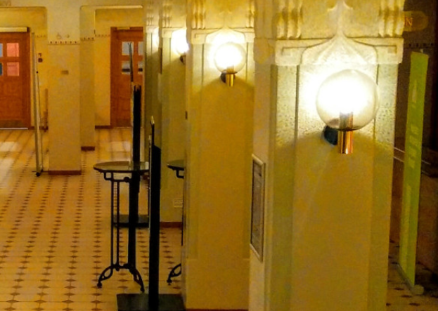 A hallway with pillars and lights.