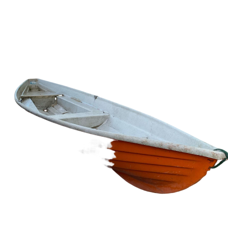 An orange boat sits on the shore of a lake.