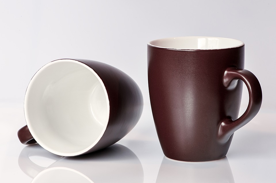 mugs-459324_960_720 Two brown mugs on a white surface.